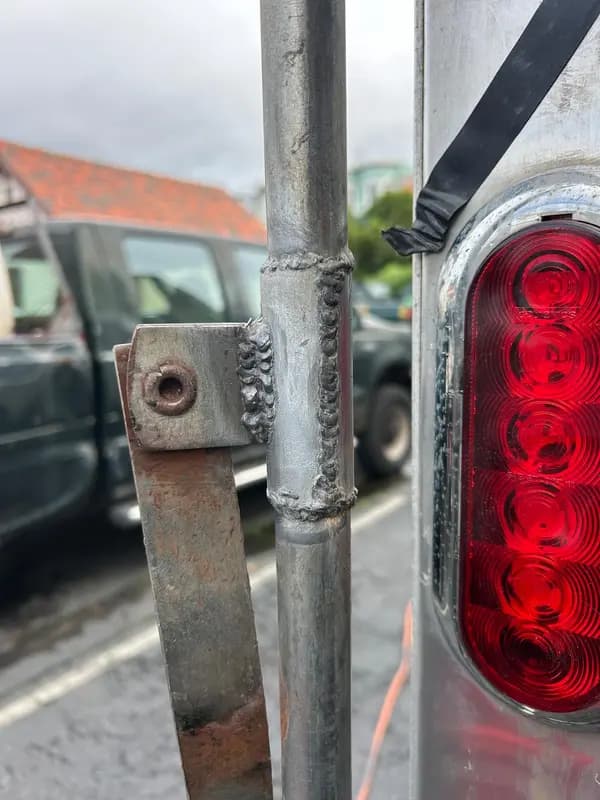 Welded bracket and tube joint on a trailer